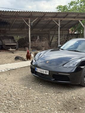 718 Cayman by a parking structure